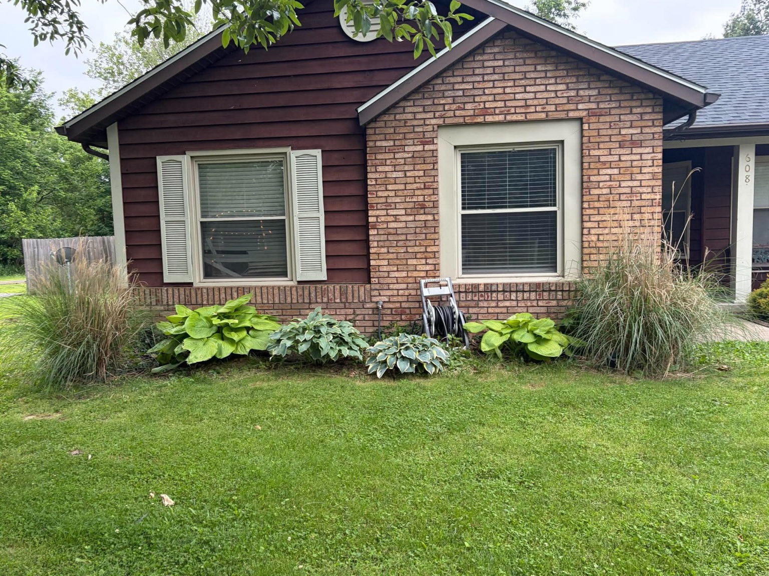 Landscape bed with established plants and shrubs