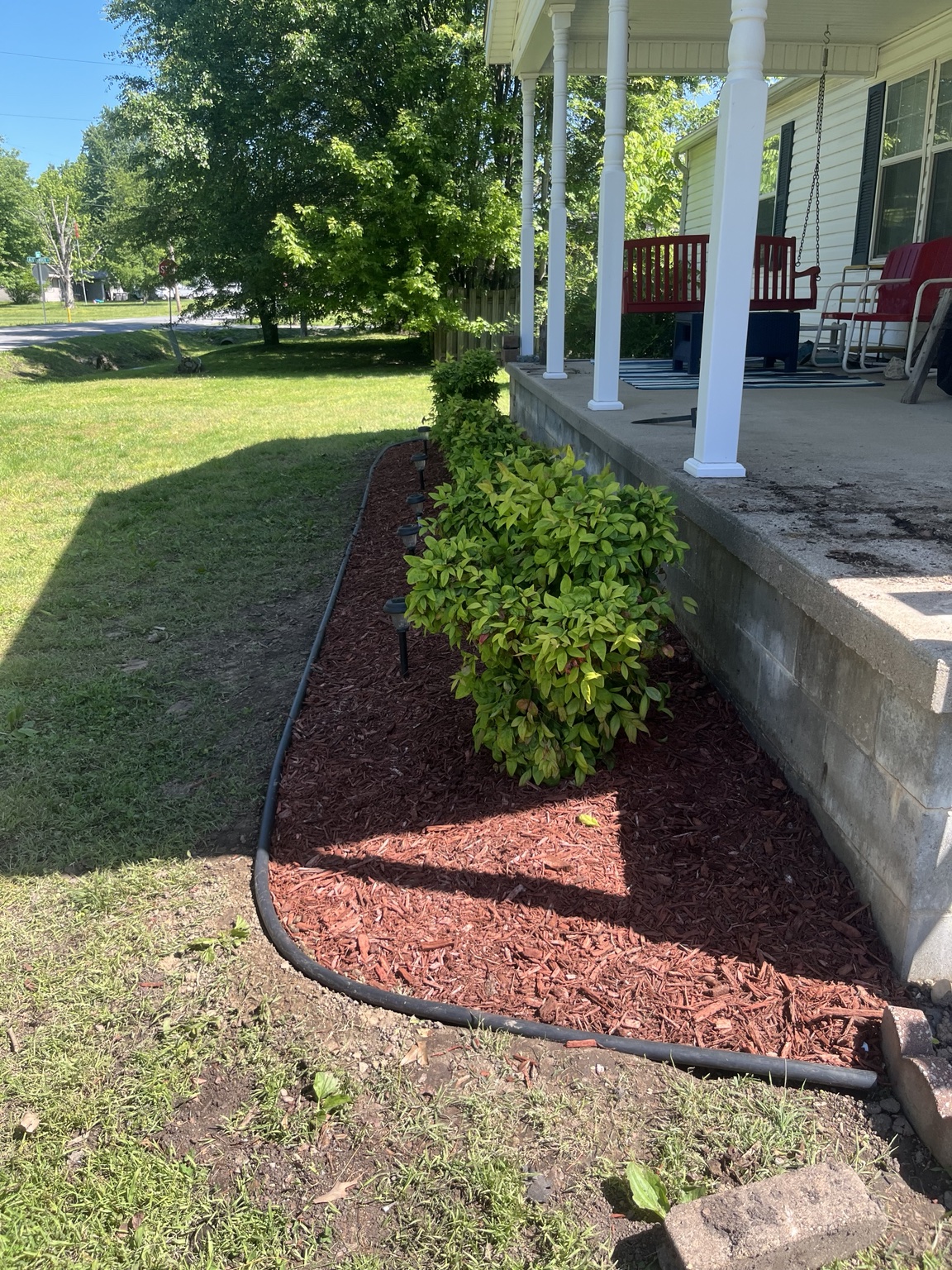 McGee's Landscaping red mulch and shrub installation